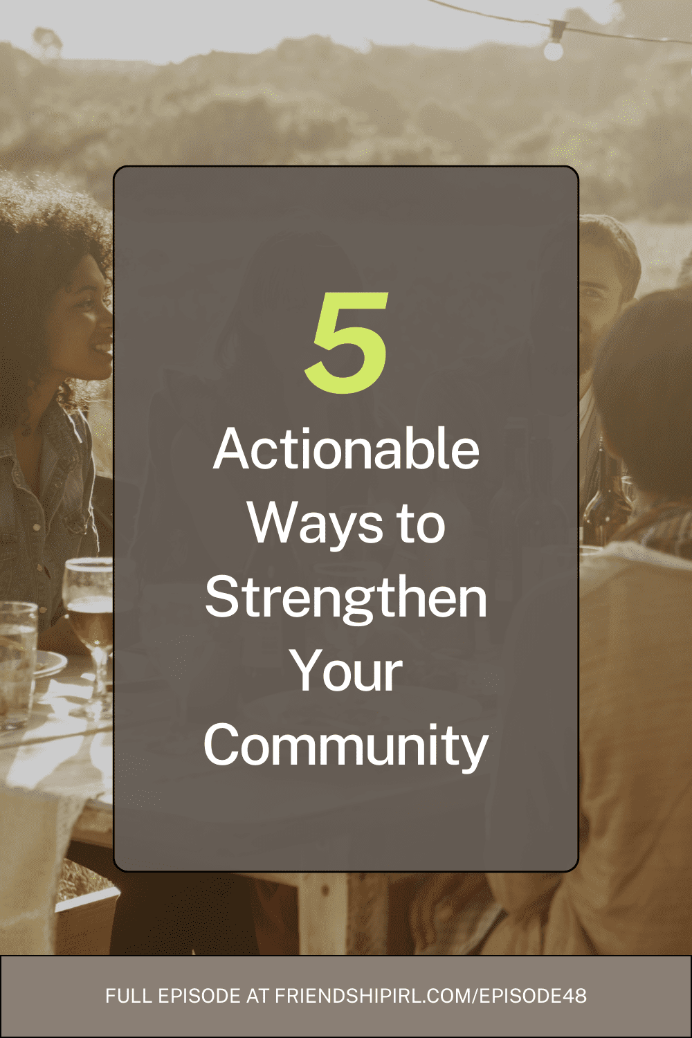 Two women laughing together at outdoor table with drinks - 